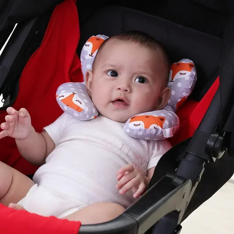 Baby using the neck support pillow in the car seat